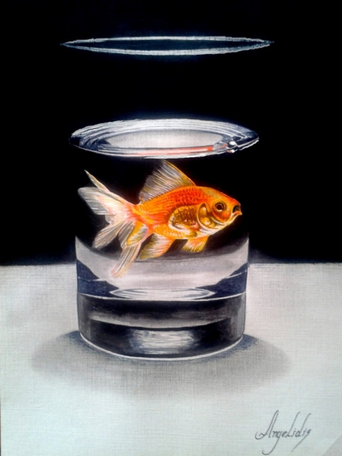 goldfish in drinking glass
